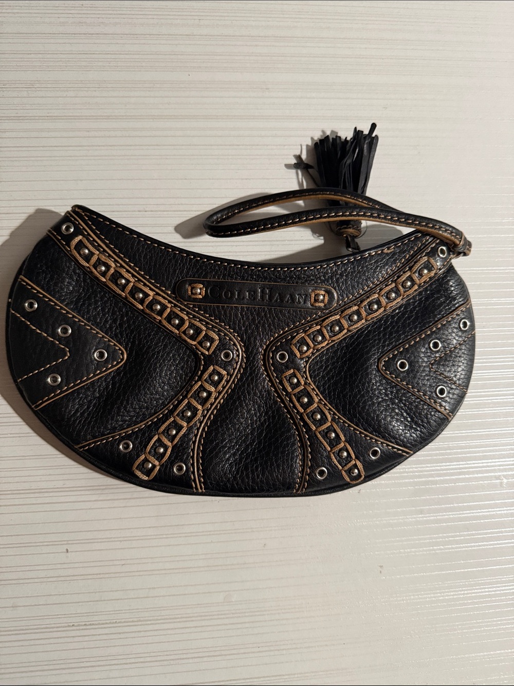 Cole Haan vintage grommet wristlet $150